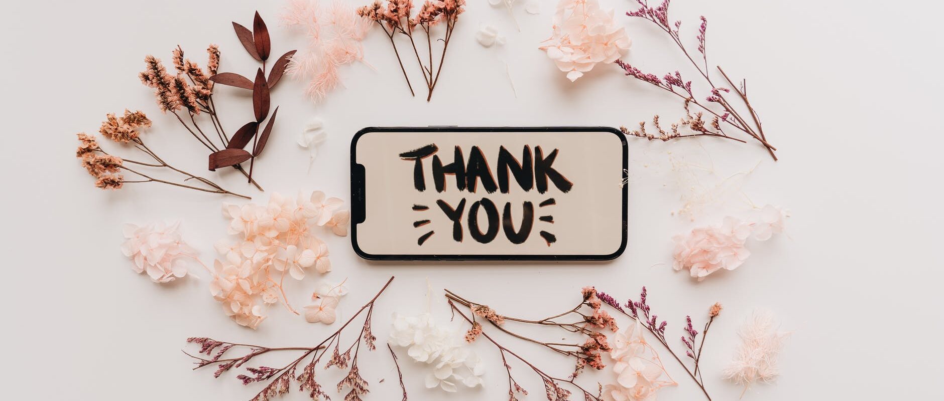 dried flowers and a mobile phone