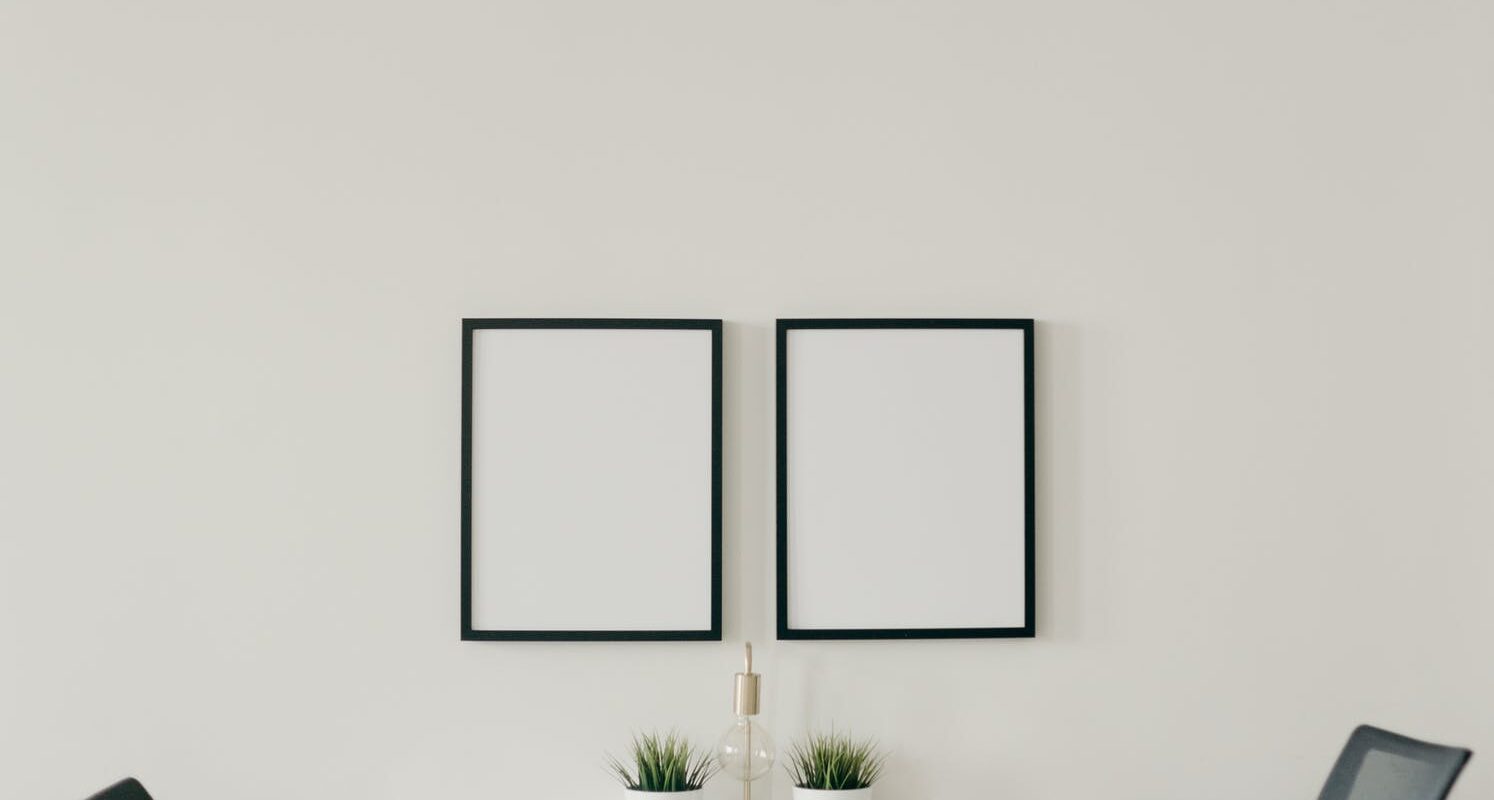 white wooden table with chairs in a room
