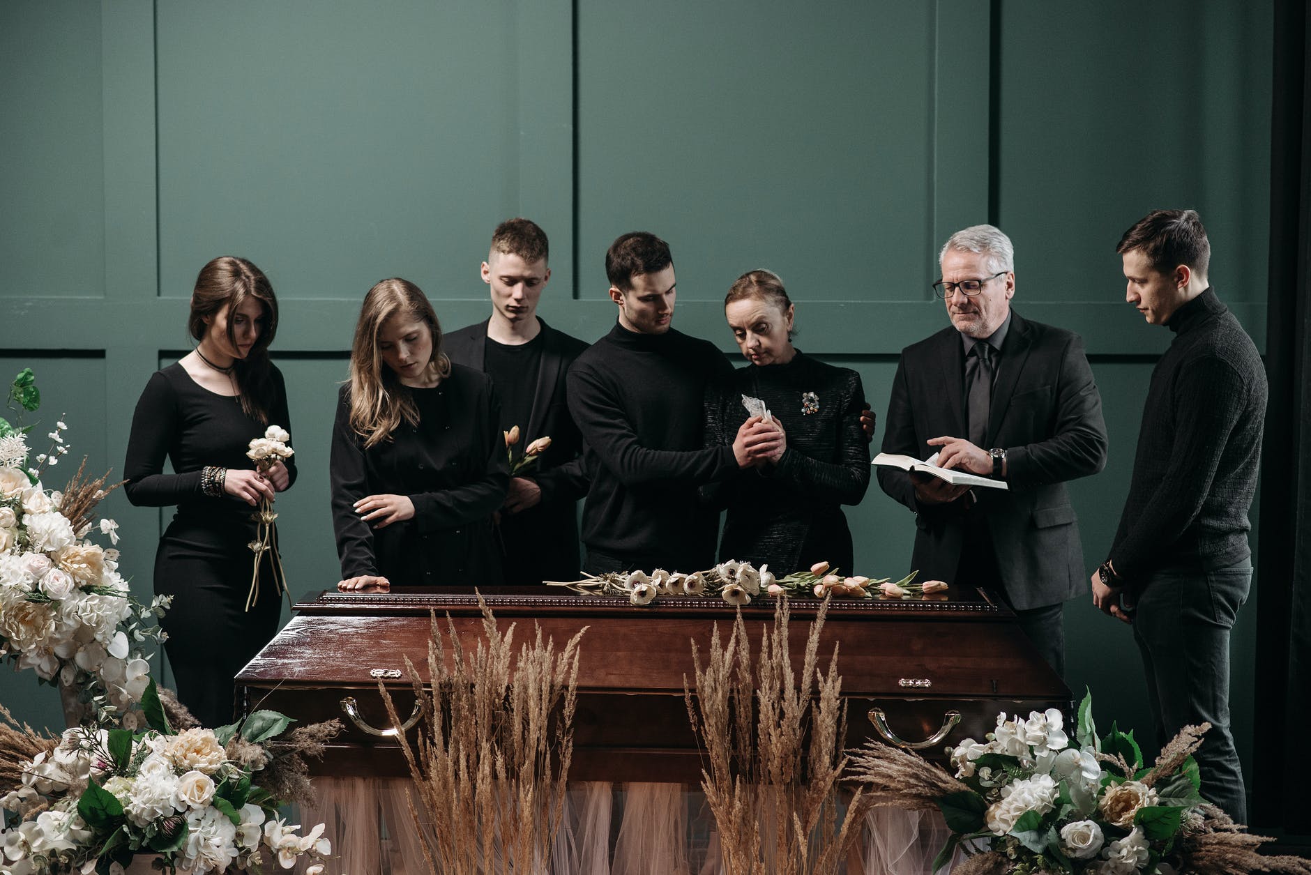 a family and a pastor in a funeral service