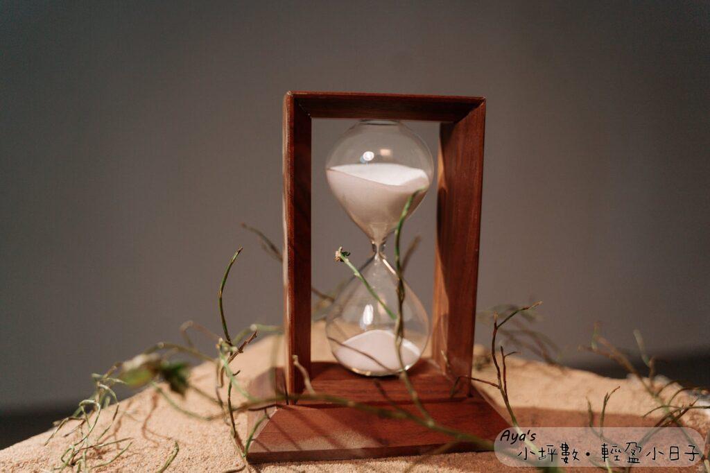 brown wooden framed hour glass